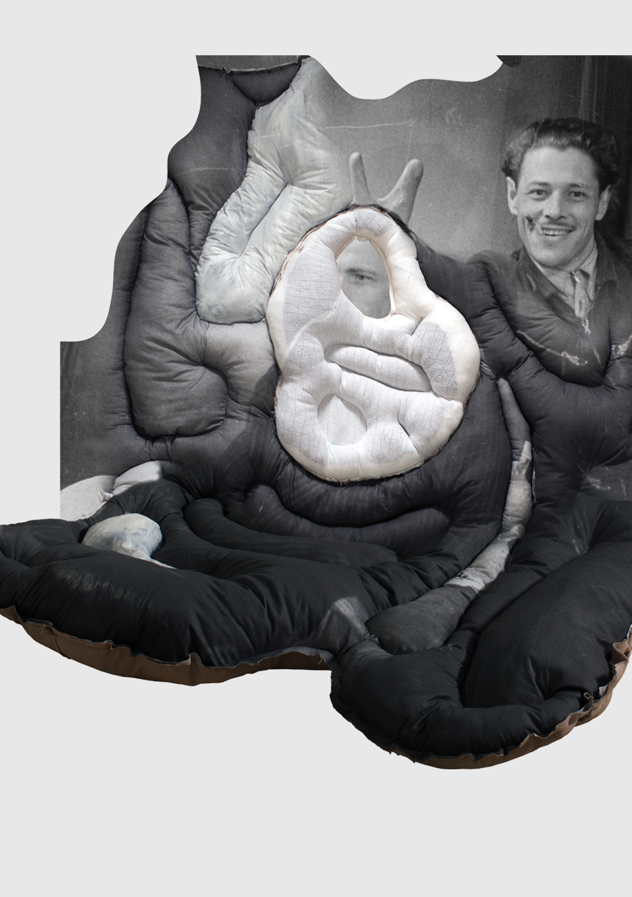 A black-and-white photo of a smiling man in the background is overlaid with soft, padded, abstract fabric shapes, partially obscuring the image.